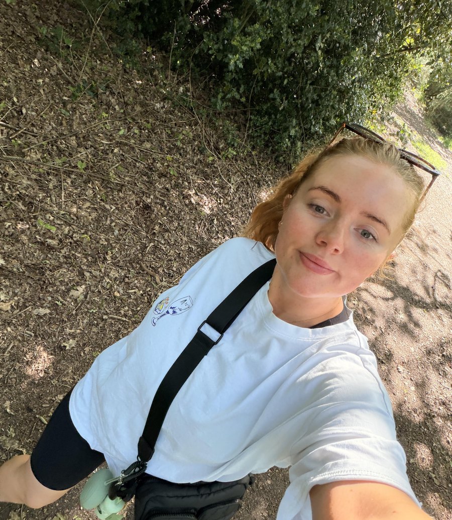 Ella walking a dog along a Cheshire path near Knutsford